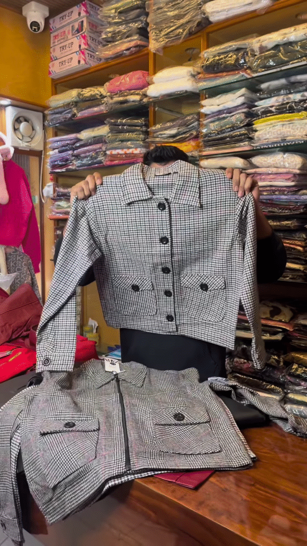 Black and White Checkered Long-Sleeve Jacket with Front Flap Pockets and Button Closure