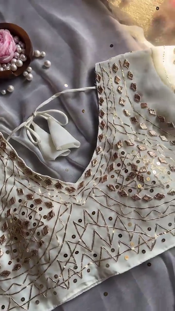 Luminous Cream Saree with Ornate Geometric Artistry